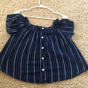Off the shoulder, blue top, button down. Does have white seems